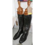 A pair of black leather riding boots, together with boot trees, H.44cm (boots)