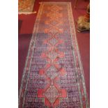 A North West Persian Senngh runner. Repeating diamond shaped medallion with an all over heratie