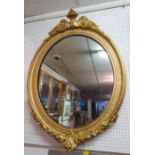 A late 19th/early 20th century neoclassical oval giltwood mirror, 110 x 80cm