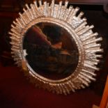 A cast aluminium framed sunburst mirror with aged plate, Diameter. 89cm