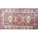 A North West Persian Nahawand rug. Triple pole medallion with repeating geometrical motifs on a