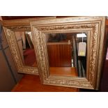 A pair of 18th century style gilt wood mirrors with holly vine border, 70 x 60cm