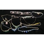 A collection of nine vintage multi coloured diamante necklaces
