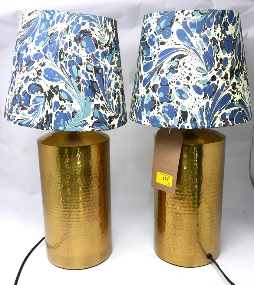 A pair of contemporary hammered copper table lamps