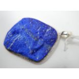 A large sterling silver and natural lapis lazuli pendant, to a sterling silver pendant loop, 7 x 4.