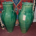 A pair of Persian green glazed Sharab wine vessels, having five handles, H.92cm (2)