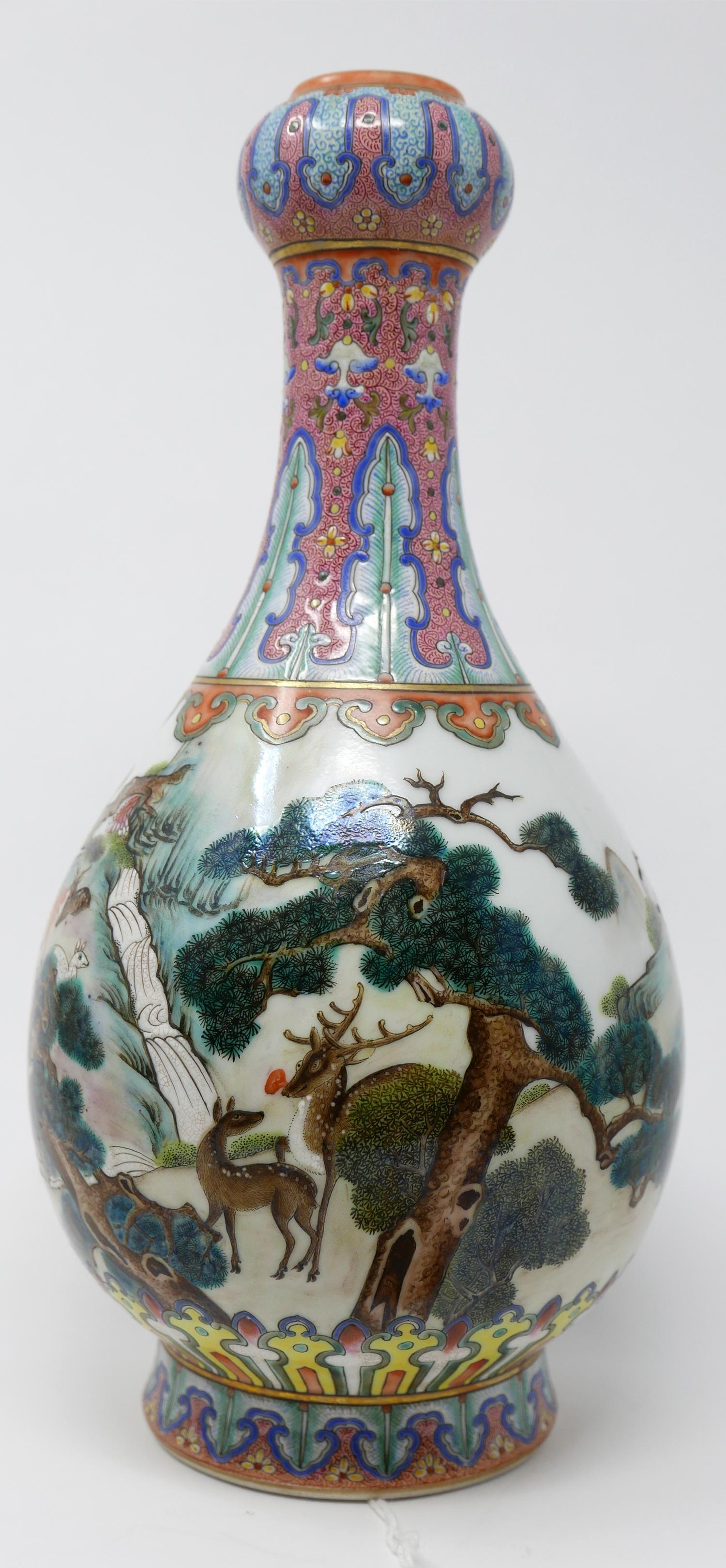 A Chinese porcelain deer vase, the garlic mouth and neck decorated with stylised flowers, the body