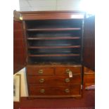 A Regency mahogany linen press, with two cupboard doors enclosing four linen trays, above two