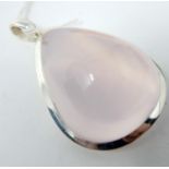 A sterling silver pendant inset with a large tear-drop shaped rose quartz cabochon to a sterling