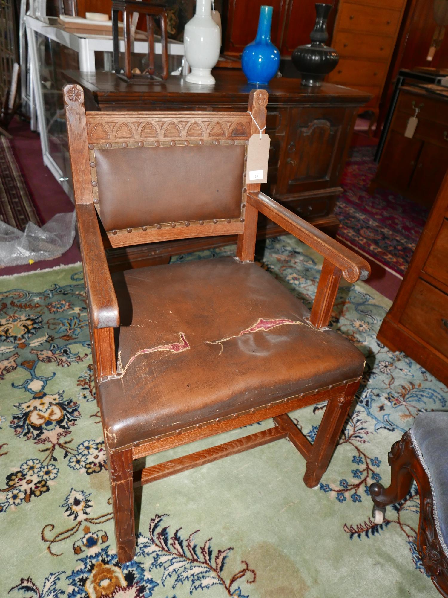 An early 20th century oak Gothic style chair