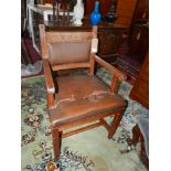 An early 20th century oak Gothic style chair