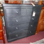 A Victorian black painted chest with two short over three long drawers, raised on bun feet, H.119