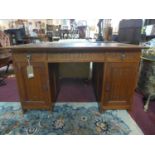 An early 20th century H.Panda & Zonen arts and crafts oak desk, with three drawers and two