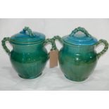 A pair of Persian cyan glazed jars and covers, with rope twist design handles, H.32cm (2)