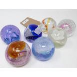 Seven Caithness glass paperweights to include cauldron, pink champagne, calypso, sirocco and ribbons