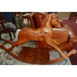 A vintage hand-carved pine rocking horse with natural horse-hair tail, 90 x 137cm