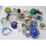 A collection of 24 art glass paperweights