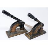 A pair of Victorian weighty iron letter stampers/embossing machines painted black with gilt hand-