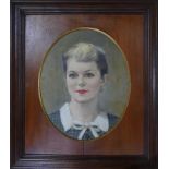 Mid 20th century school, head and shoulder portrait of a lady, oil on canvas laid down, feigned to