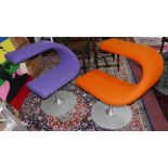 A pair of Swedish Bla Station 'C' swivel chairs, stamped to base, upholstered in purple and orange