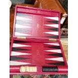 A Dunhill backgammon set, with counters, in red leather travelling case, with original bag, 41 x