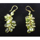 A pair of 14ct yellow gold peridot grape-cluster earrings set with twelve natural faceted peridot
