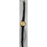 A vintage Omega ladies cocktail watch, gilt dial with baton markers, on associated strap with