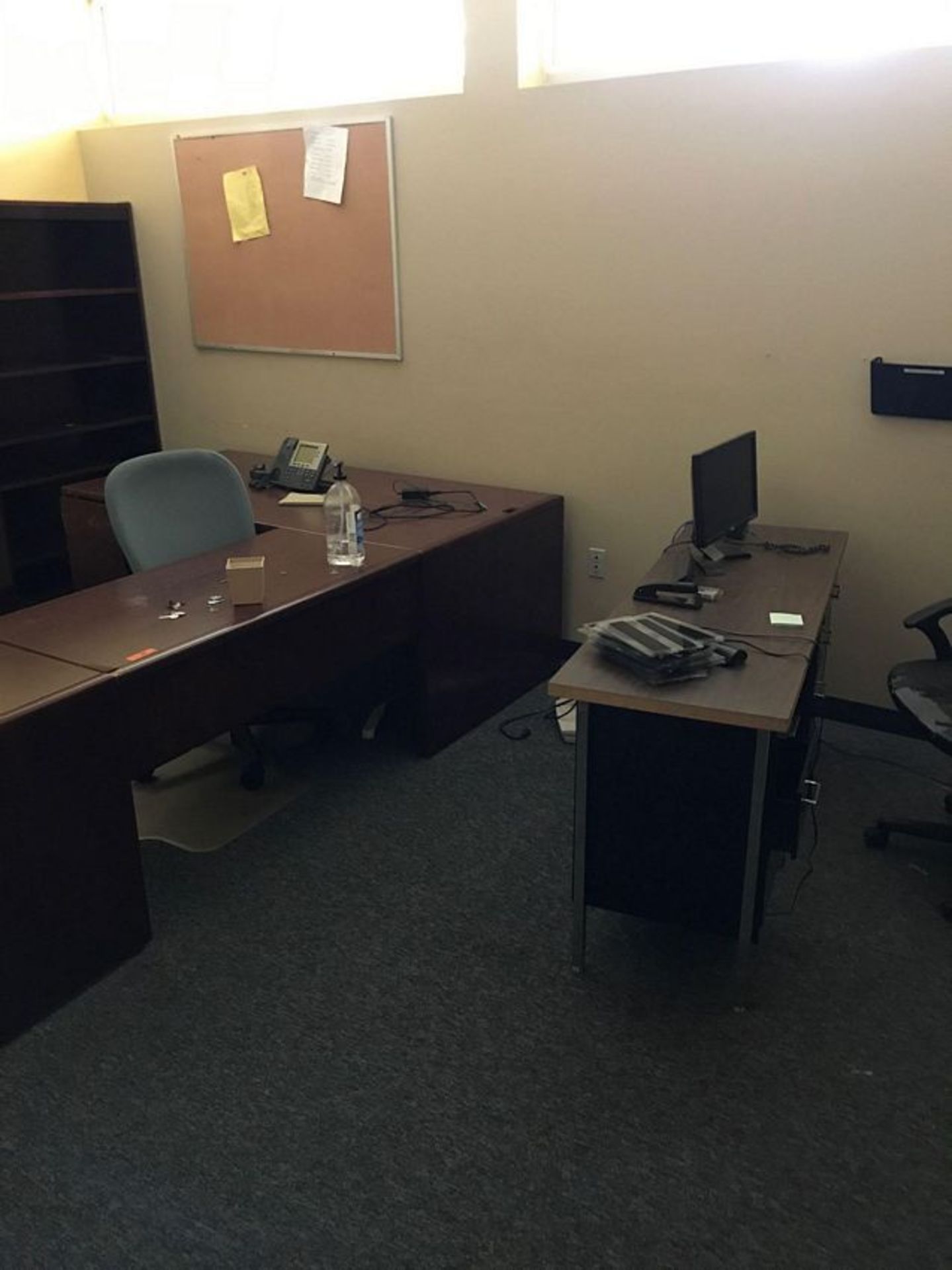 OFFICE TO INCLUDE (2) WOOD DESKS, (2) OFFICE CHAIRS, (2) CISCO PHONES AND (1) MONITOR