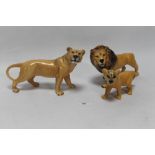 THREE BESWICK FIGURES ONE OF A LION, A LIONESS AND A CUB