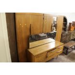 A RETRO BEDROOM SUITE CONSISTING OF A DRESSING TABLE AND TWO WARDROBES A/F