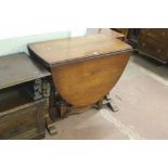 AN OAK GATE LEG DROP LEAF TABLE