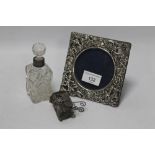 A HALLMARKED SILVER PICTURE FRAME, TOGETHER WITH A SILVER COLLARED SCENT BOTTLE, ETC