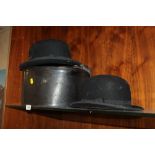 A HAT BOX TOGETHER WITH TWO BOWLER HATS