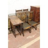 AN OAK DROP LEAF TABLE TOGETHER WITH FOUR CARVED OAK BARLEY TWIST CHAIRS