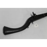 AN ANTIQUE INDO-PERSIAN STYLE MUZZLE LOADING PERCUSSION RIFLE, plain barrel with sweeping stock,