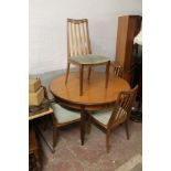 A TEAK DINING ROOM TABLE TOGETHER WITH FOUR TEAK G PLAN CHAIRS