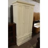 AN ANTIQUE WHITE PAINTED PINE WARDROBE