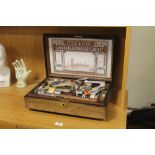 A SEWING BOX AND CONTENTS