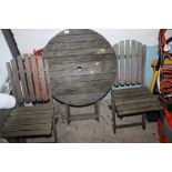 A SMALL WOODEN GARDEN TABLE AND TWO CHAIRS