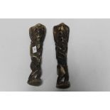 A PAIR OF AFRICAN CARVED BONE FIGURES OF STANDING WARRIORS, H 32 cm