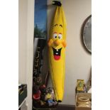 A LARGE BANANA SOFT TOY, TOGETHER WITH OTHER SOFT TOYS TO INCLUDE ROLAND RAT, ET, ETC