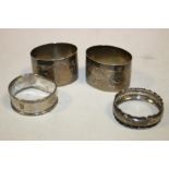 A PAIR OF HALLMARKED SILVER BRIGHT CUT ENGRAVING NAPKIN RINGS - BIRMINGHAM 1947 TOGETHER WITH TWO