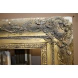 A LARGE VINTAGE ORNATE GILT PICTURE FRAME A/F