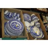 TWO TRAYS OF BLUE AND WHITE WILLOW PATTERN TEA AND DINNER WARE