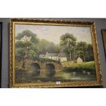 A LARGE GILT FRAMED OIL ON BOARD RIVER SCENE BY P. F. WILLIAMS