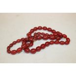 A VINTAGE CHERRY AMBER STYLE NECKLACE