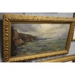 E. JOHNSON. A late 19th / early 20th century rocky coastal scene with harbour and sailing vessels,
