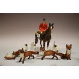 A BESWICK HUNTSMAN ON HORSEBACK TOGETHER WITH FOUR BESWICK FOXES AND FOUR BESWICK HUNTING HOUNDS (