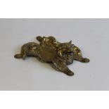 AN UNUSUAL ANTIQUE BRASS INK STAND IN THE FORM OF A FOX, the body flattened to make a tray, with th