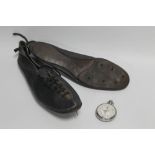 A PAIR OF EARLY 20TH CENTURY RUNNING SPIKES, along with a 1936 Berlin Olympics stop watch